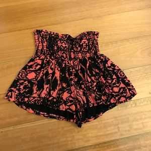 Flowy black & coral colored shorts.